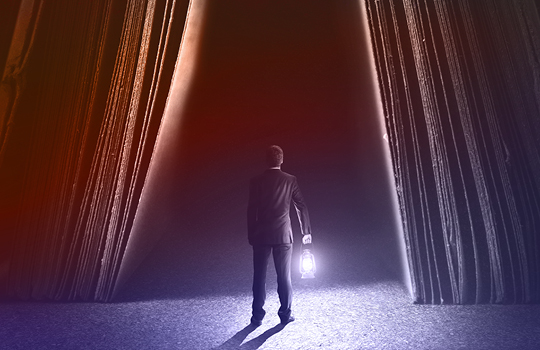 Businessperson on stage gleans new insights about LLM performance, symbolized by a lit-up lantern.