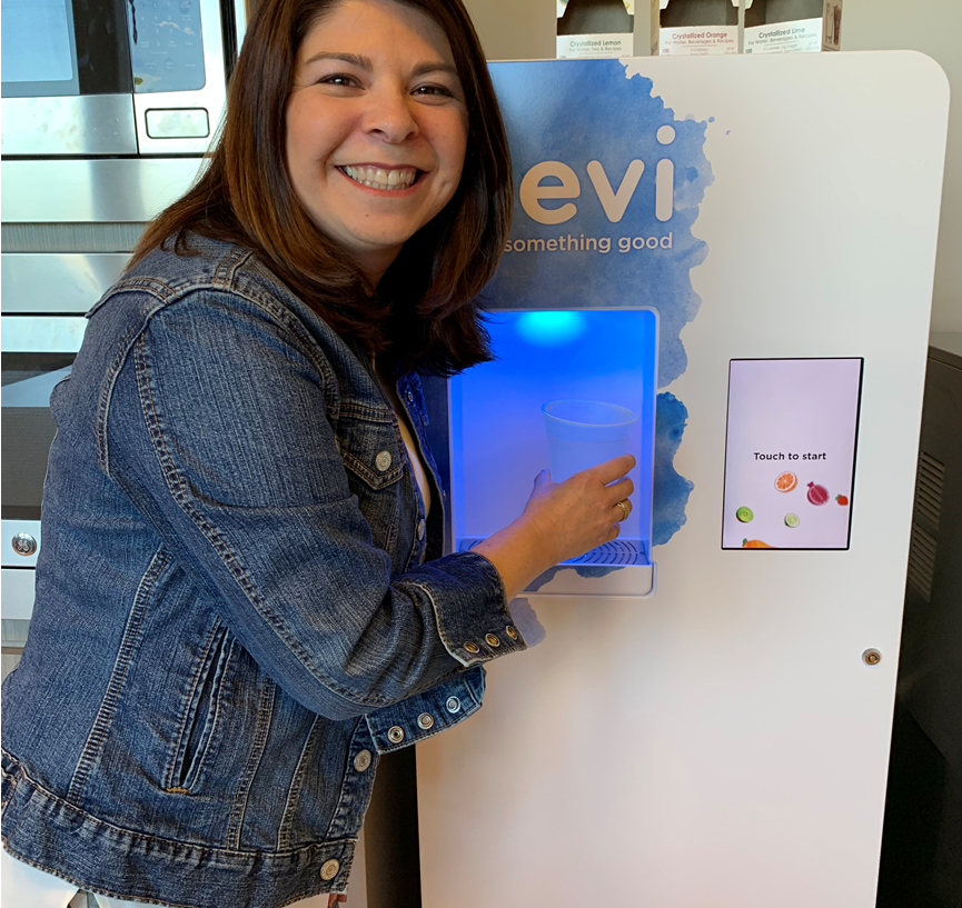 Cindy smiling with the bevi machine