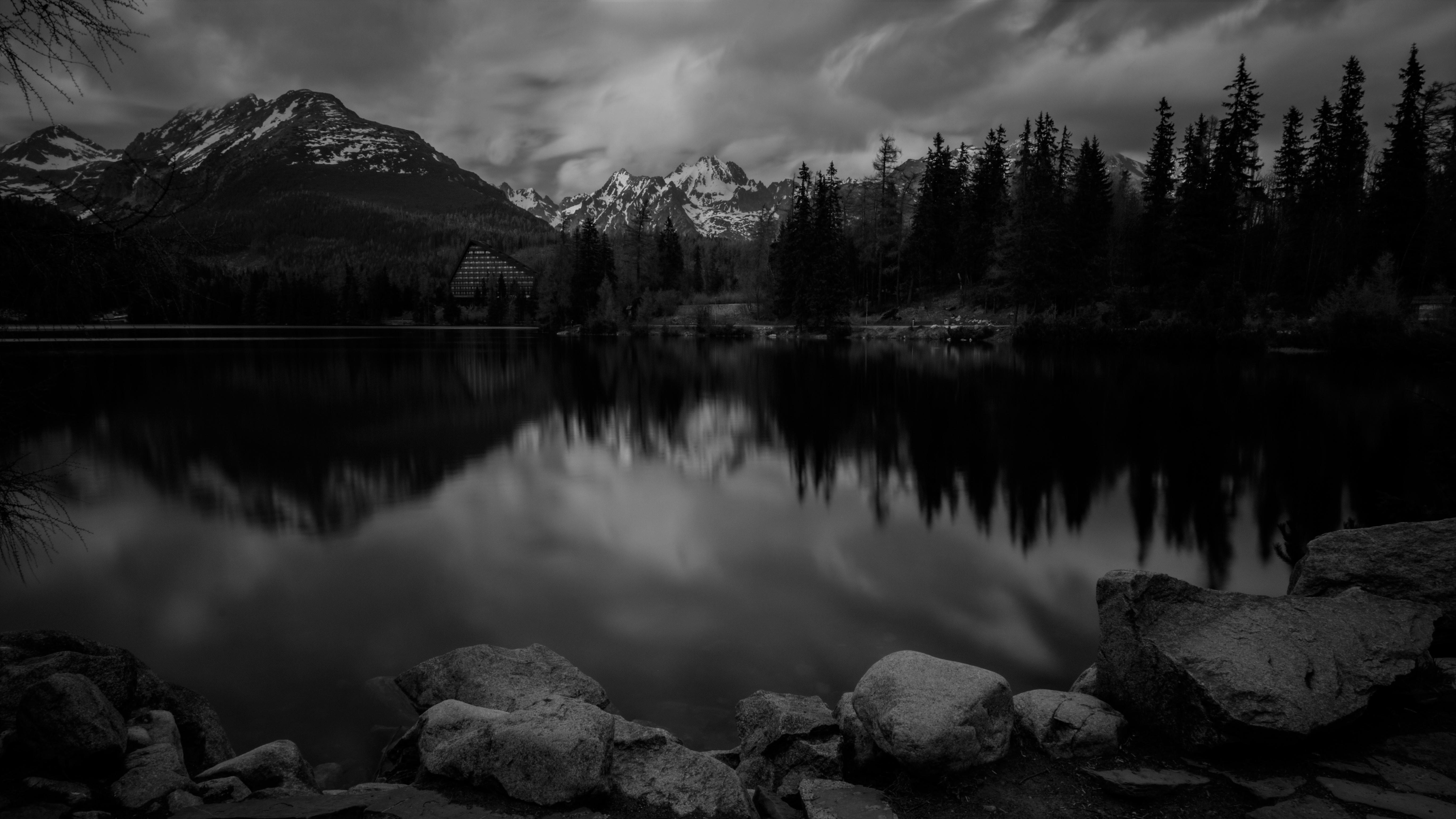 Mountains reflecting on lake in Slovakia,, home country of Branislav Sulovsky Project Management Group Manager