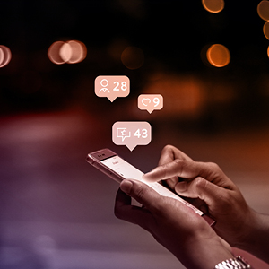 Person on a mobile device looking at social media comments