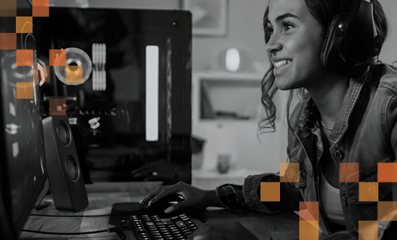 Smiling person with headset playing a video game  