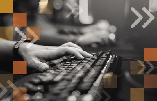 Hands typing on keyboard