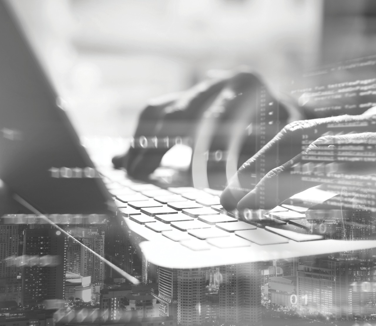 Person working with data on a computer with a busy city in the background