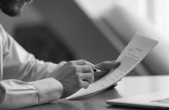 Businessperson reading legal document