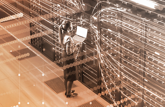 person standing at servers with digitized connecting lines