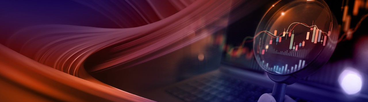orange swirl and a magnifying glass over a computer with data 