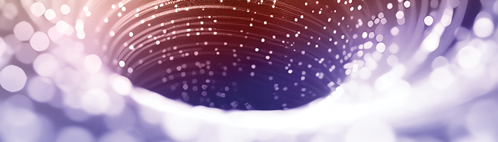 swirling orange and purple hole with sparkles