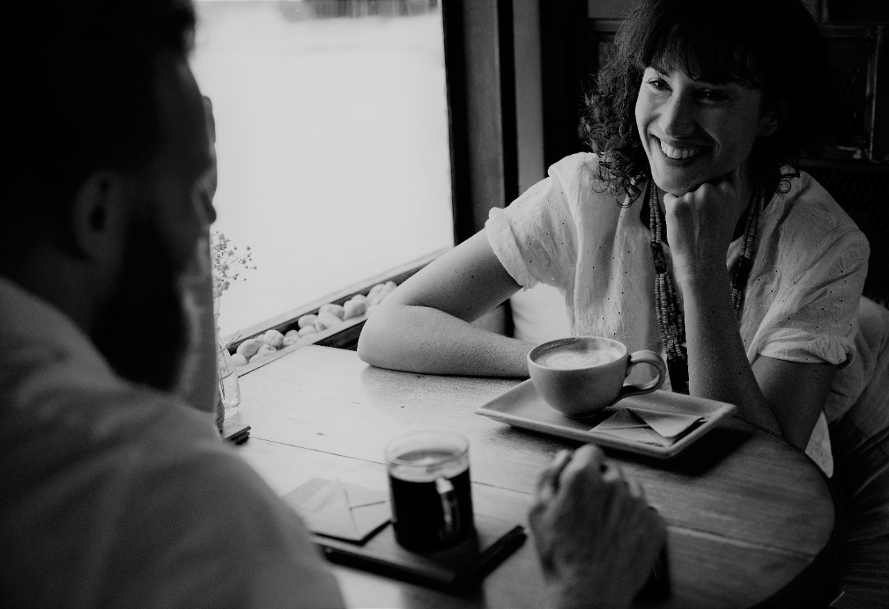 Two women chatting in a cafe
