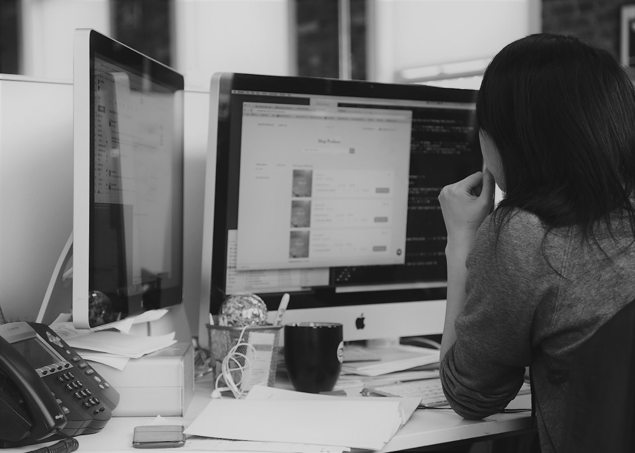 Person staring at computer monitor 