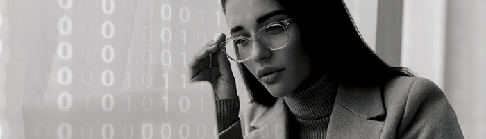 A woman looking at a laptop