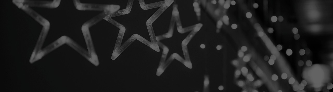 Star-shaped lights fade into the background.