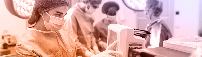 medical researcher looking at a screen 