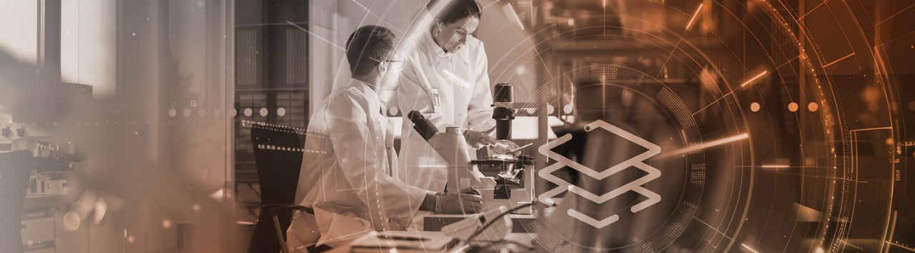 Clinical researchers looking through microscopes