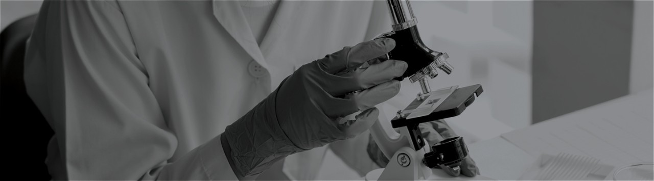 A scientist using a microscope