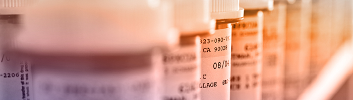 Medication bottles with labels, underscoring the importance of accurate clinical labeling for study start-up 