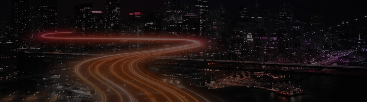 City skyline at night with futuristic pathway circling skyscrapers, representing high-quality global communication in the age of AI. 