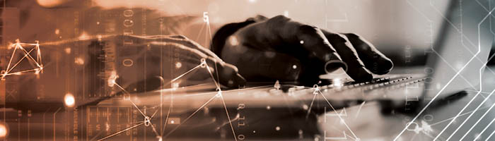 A geometric pattern is overlaid on a close-up of hands typing on a laptop.