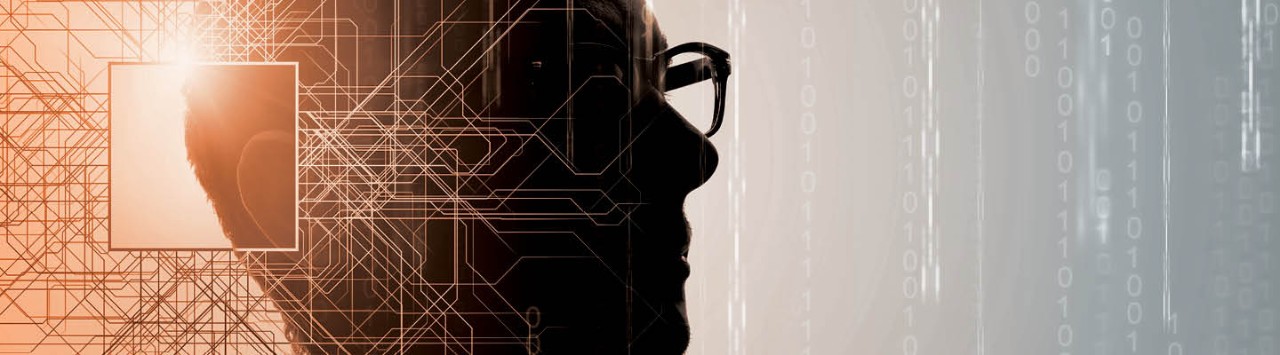 Silhouette of a man wearing glasses. A geographic pattern is overlaid on half the image, and binary code is in the background of the other half of the image.