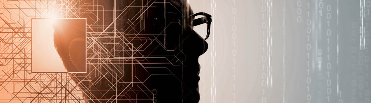 Silhouette of a man wearing glasses. A geographic pattern is overlaid on half the image, and binary code is in the background of the other half of the image.
