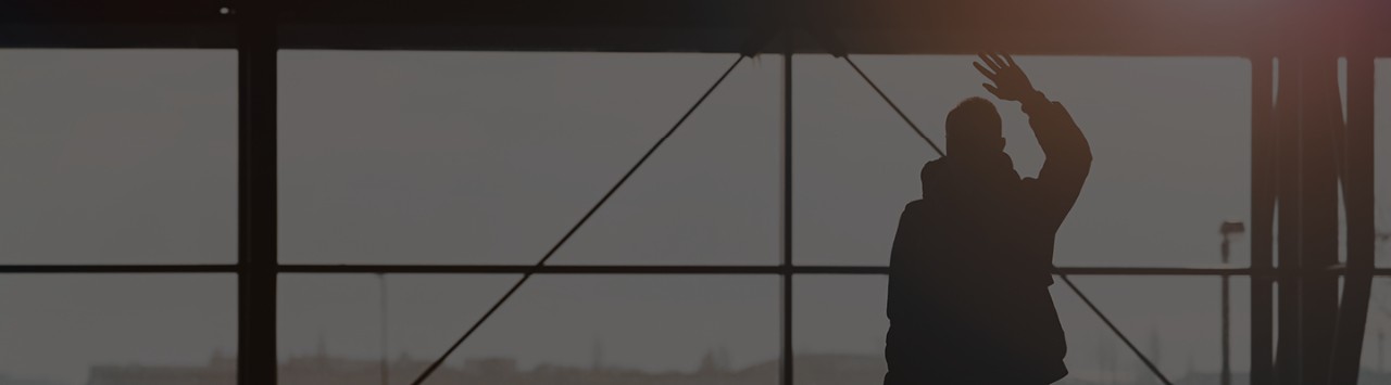 A person waves goodbye. 