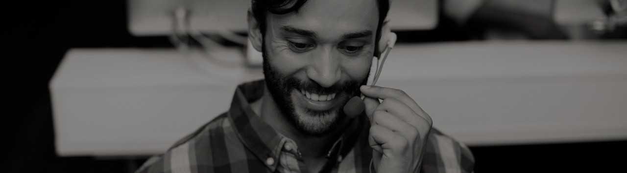 A man speaking on a headset