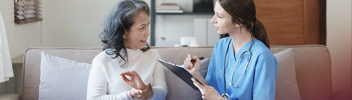 A medical professional gathering patient information, reinforcing the need for effective language services in medical settings. 