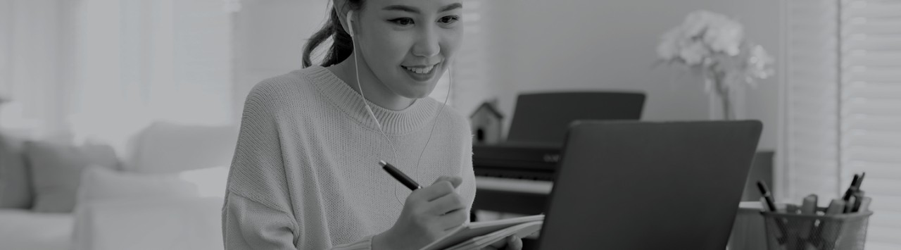 A woman looking at a laptop