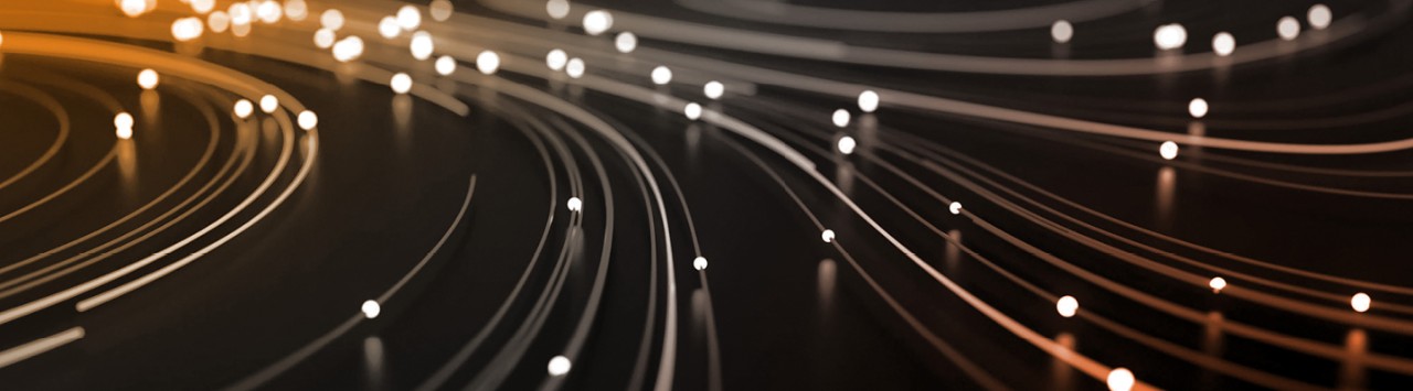 Light streaks representing the speed and efficiency of Lionbridge Aurora AI technology.