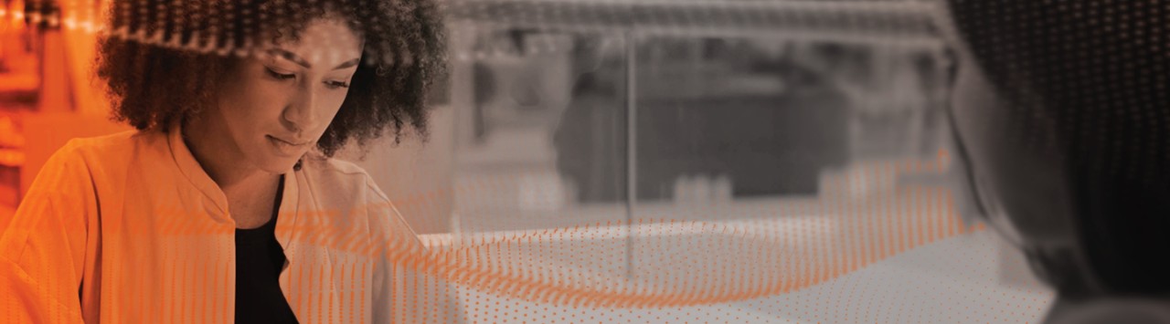 Person working on a laptop with digital overlay