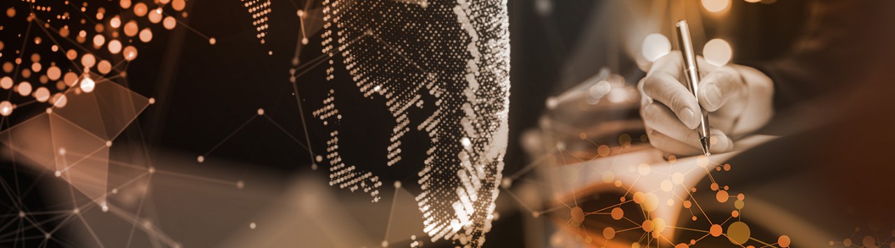 person taking notes and a digitized globe 