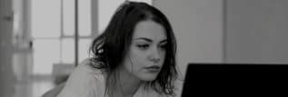 Person reading clinical trial information on a website