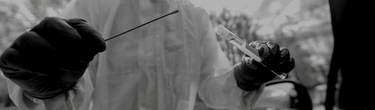 Researcher holding a vile