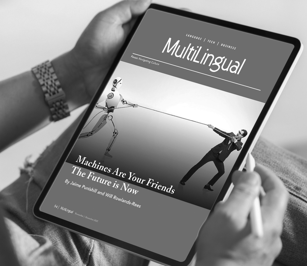 Person reading an article written by Lionbridge in Multilingual Magazine
