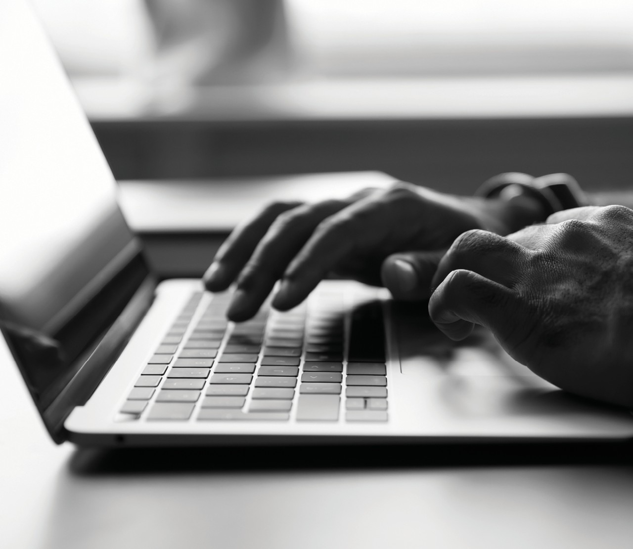 Person typing on laptop