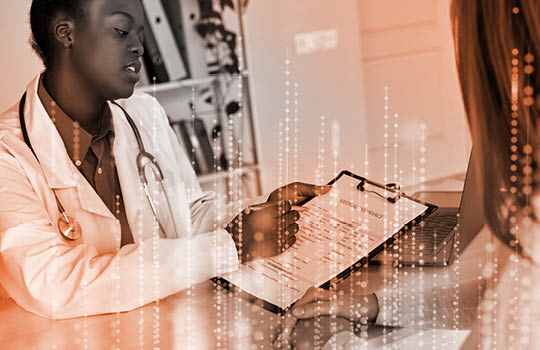 Clinical researcher and patient reviewing forms