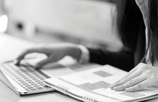 Person on computer reviewing medical devide timeline