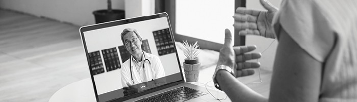 A patient consulting with a doctor via telehealth