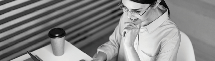 Woman working at a desk.