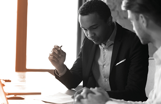 Lawyer reviewing a legal document with a client