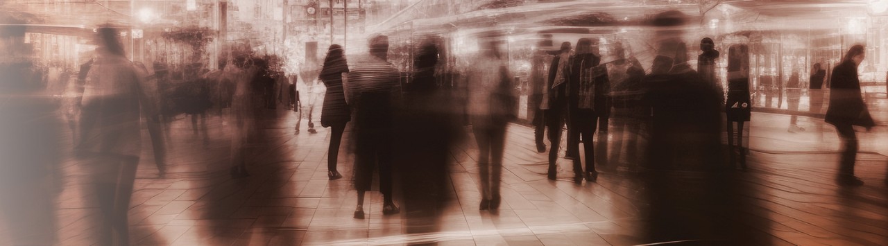 People moving in a crowded train station
