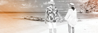 Happy couple walking on beach