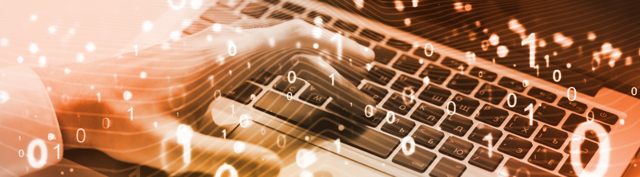 Hand on keyboard with digital icons overlayed