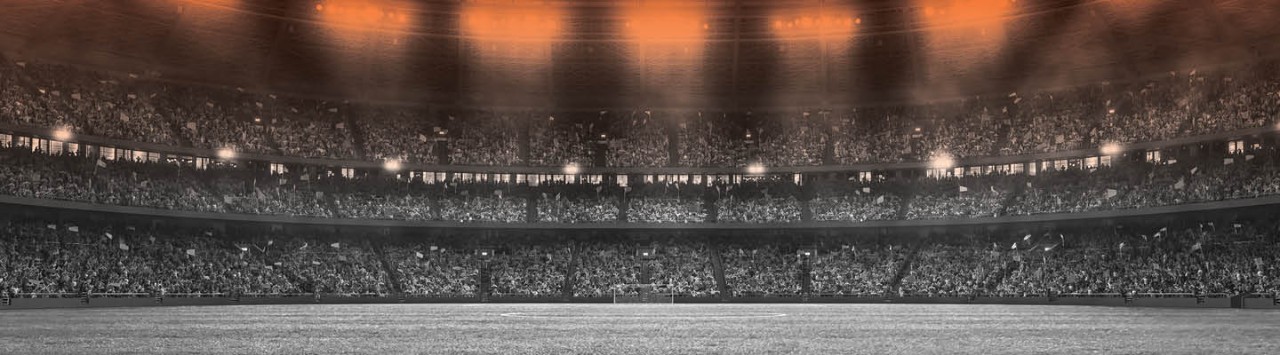 Wide shot of a football stadium stand from the pitch