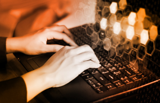 Person typing on laptop