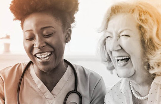 Medical professional and patient smiling