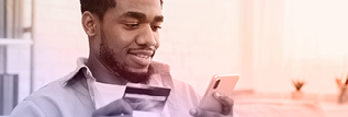 A man shopping on a phone using his credit card