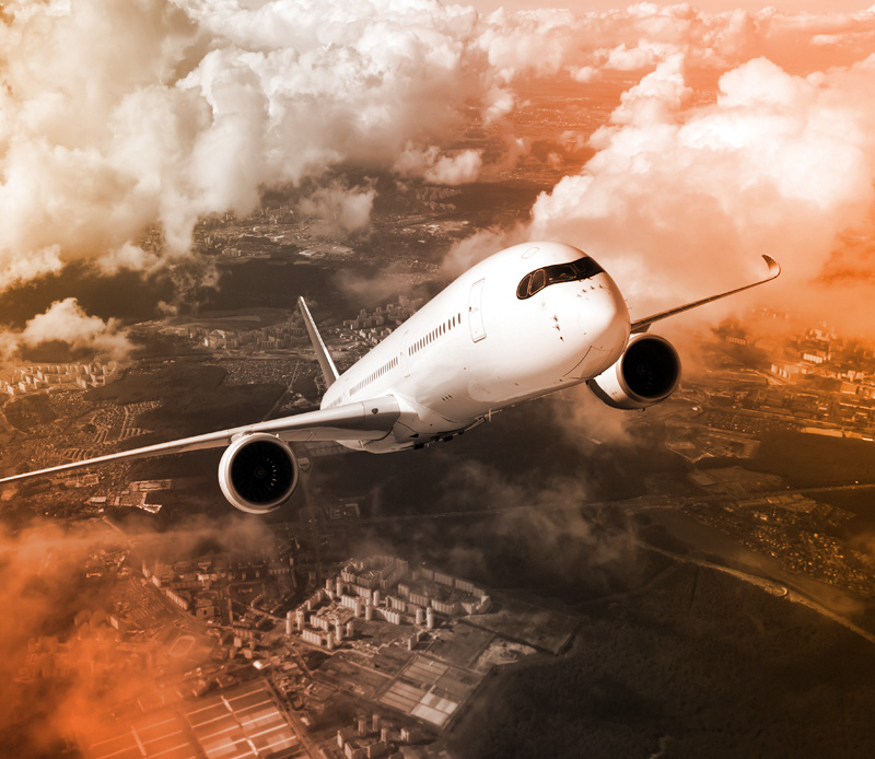 an airplane ascending in clouds