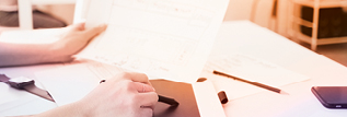 An employee working on a sheet