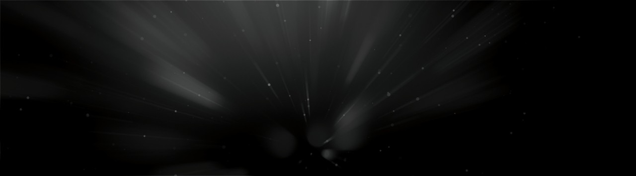 Black background illuminated by small circles and faint light burst