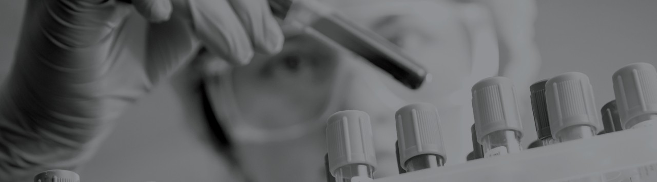 A scientist using a dropper
